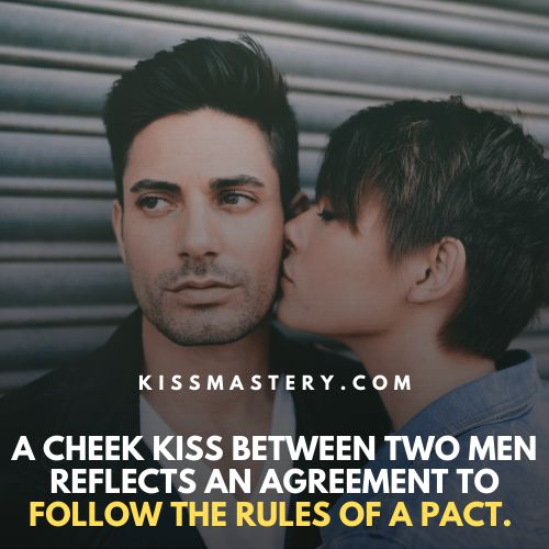 A cheek kiss between men reflects an agreement to carry out the pact.